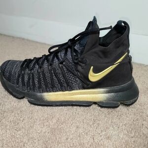 Nike Black and Gold High-Top Sneaker